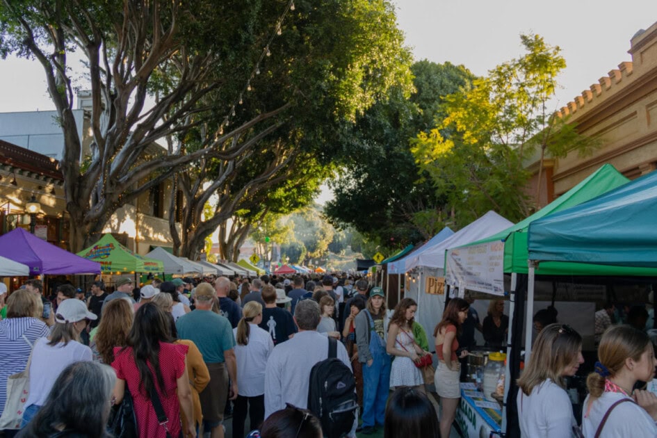 Tents line Higuera Street in Downtown San Luis Obispo for the weekly farmers market. a summer thing to do in San Luis Obispo