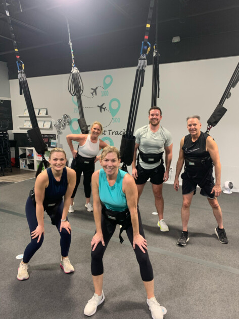 Group of people inside fitness studio