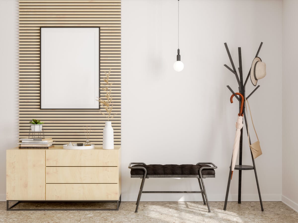 Modern hallway interior with frame, hanging umbrella and shoe cabinet