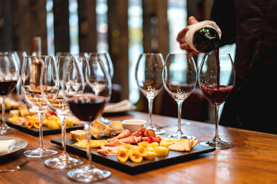 Sommelier serving glasses of winetasting event