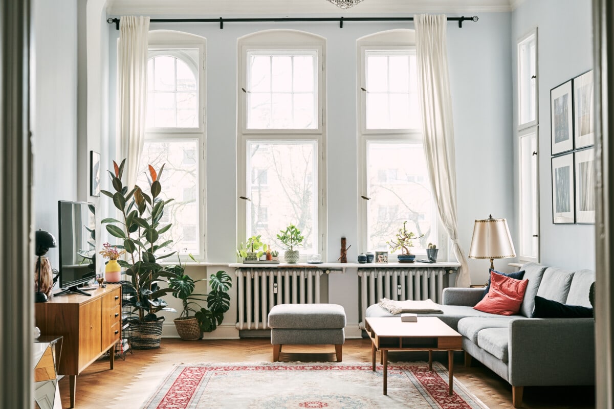 living room with lots of windows and curtains