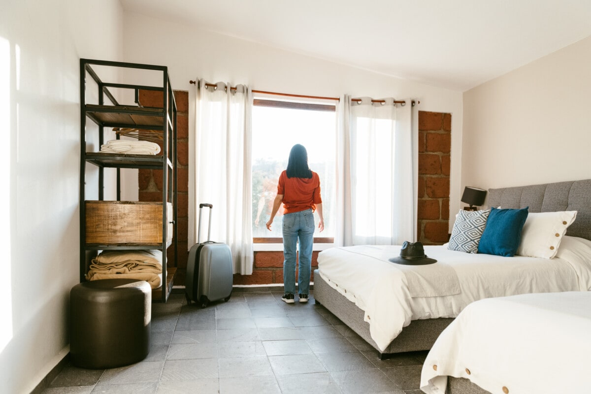 women in a well lit rented room