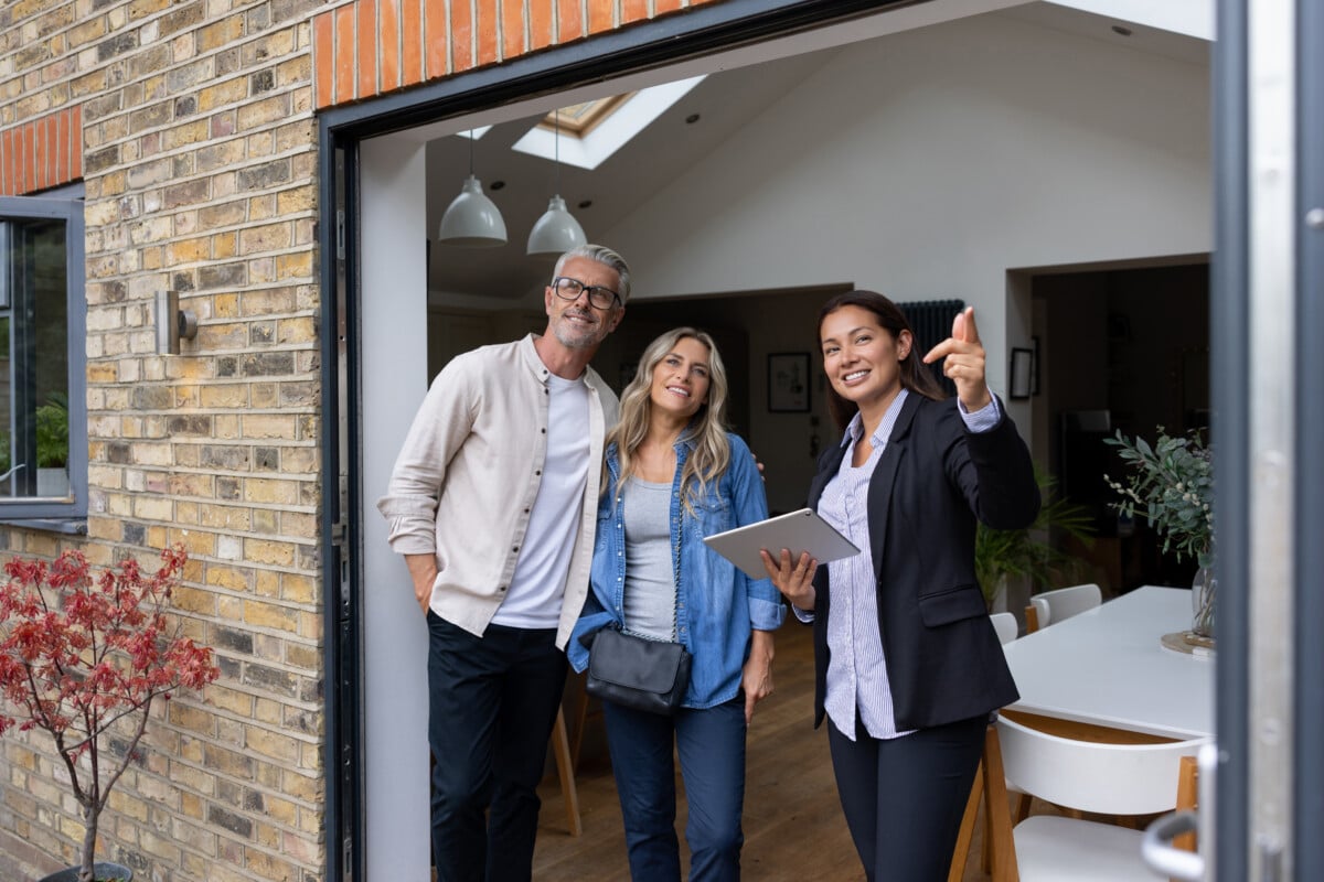 Real estate agent showing houses