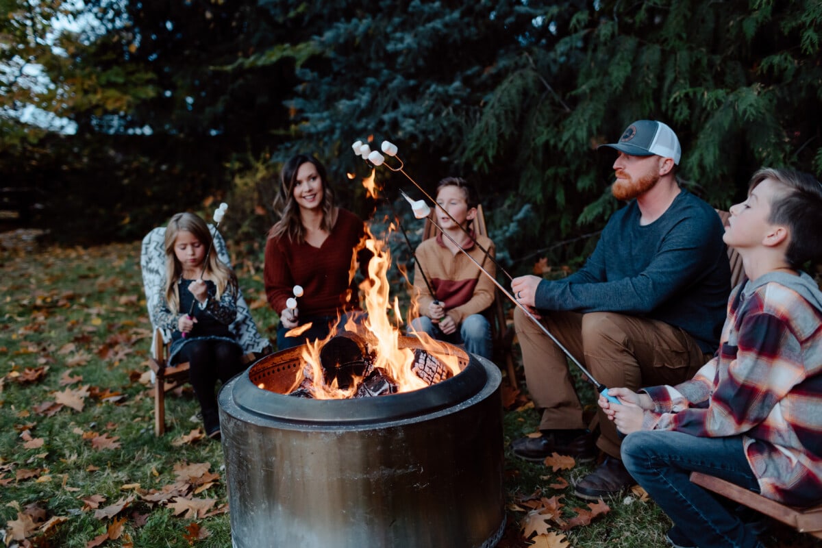 oasting marshmallows around fire