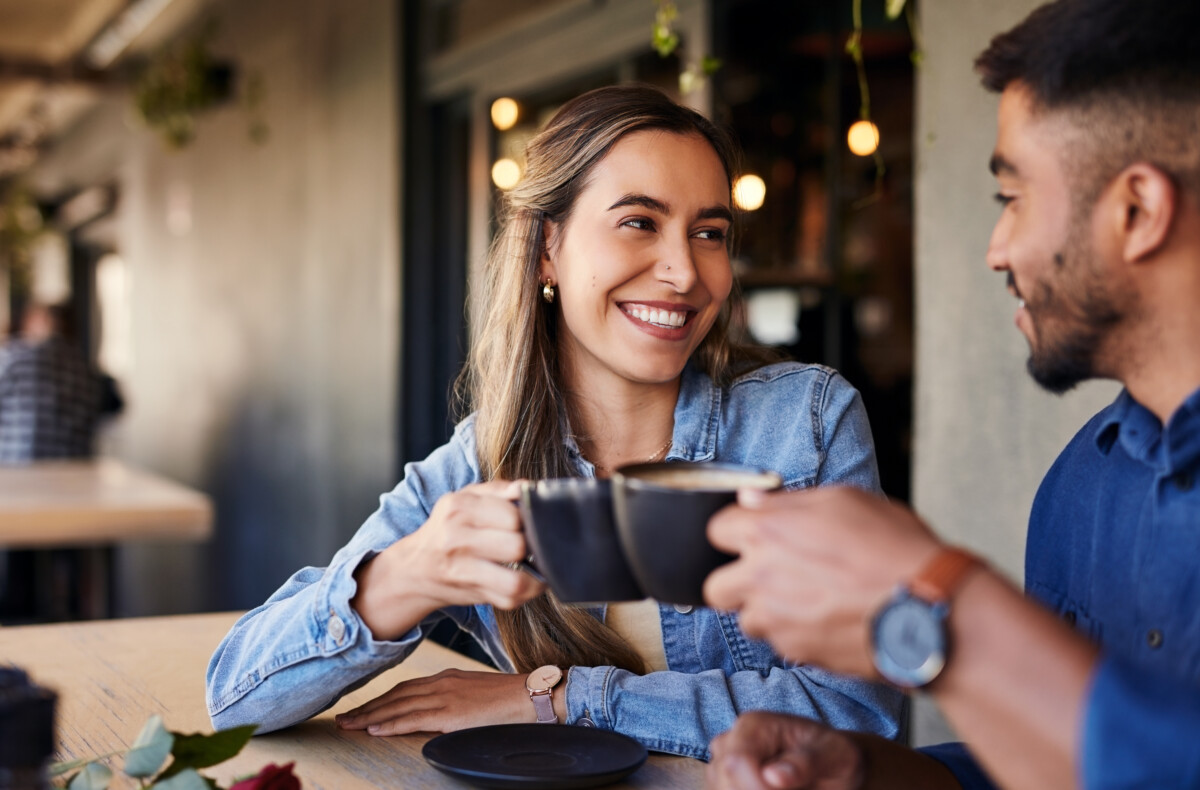 woman cheers with coffee mug