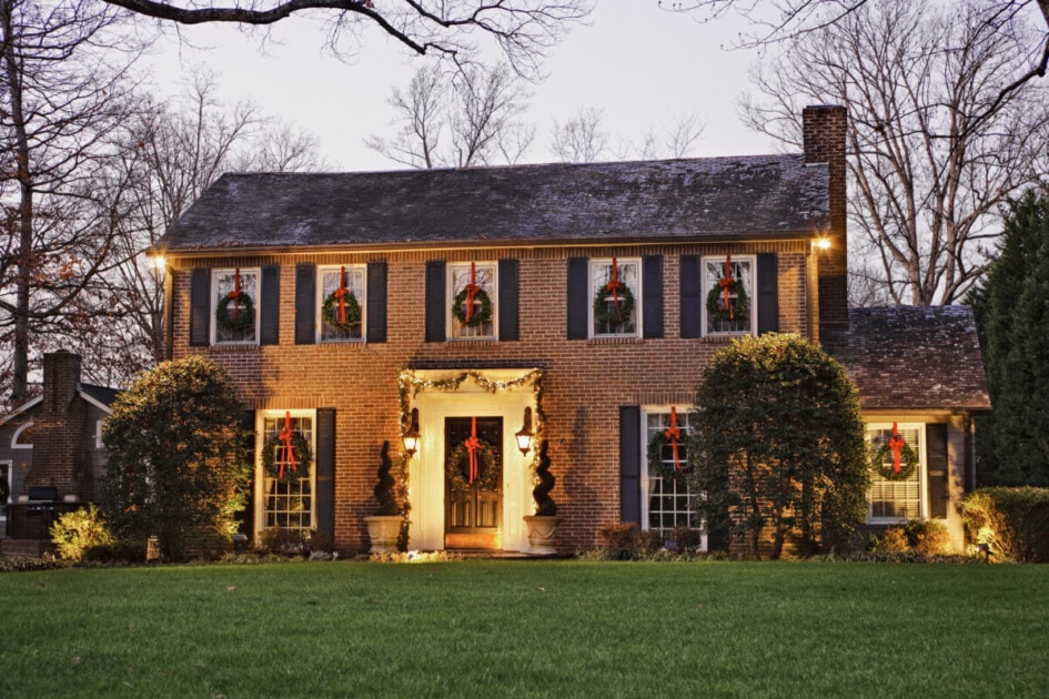 Colonial-style home decorated with christmas lights