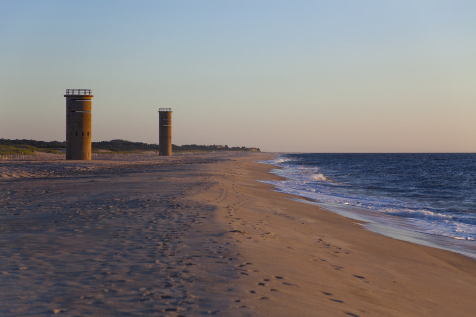 Early morning (sunrise) scene of WWII observation towers on beach near Gordon's Pone in Rehoboth Beach, Delaware.