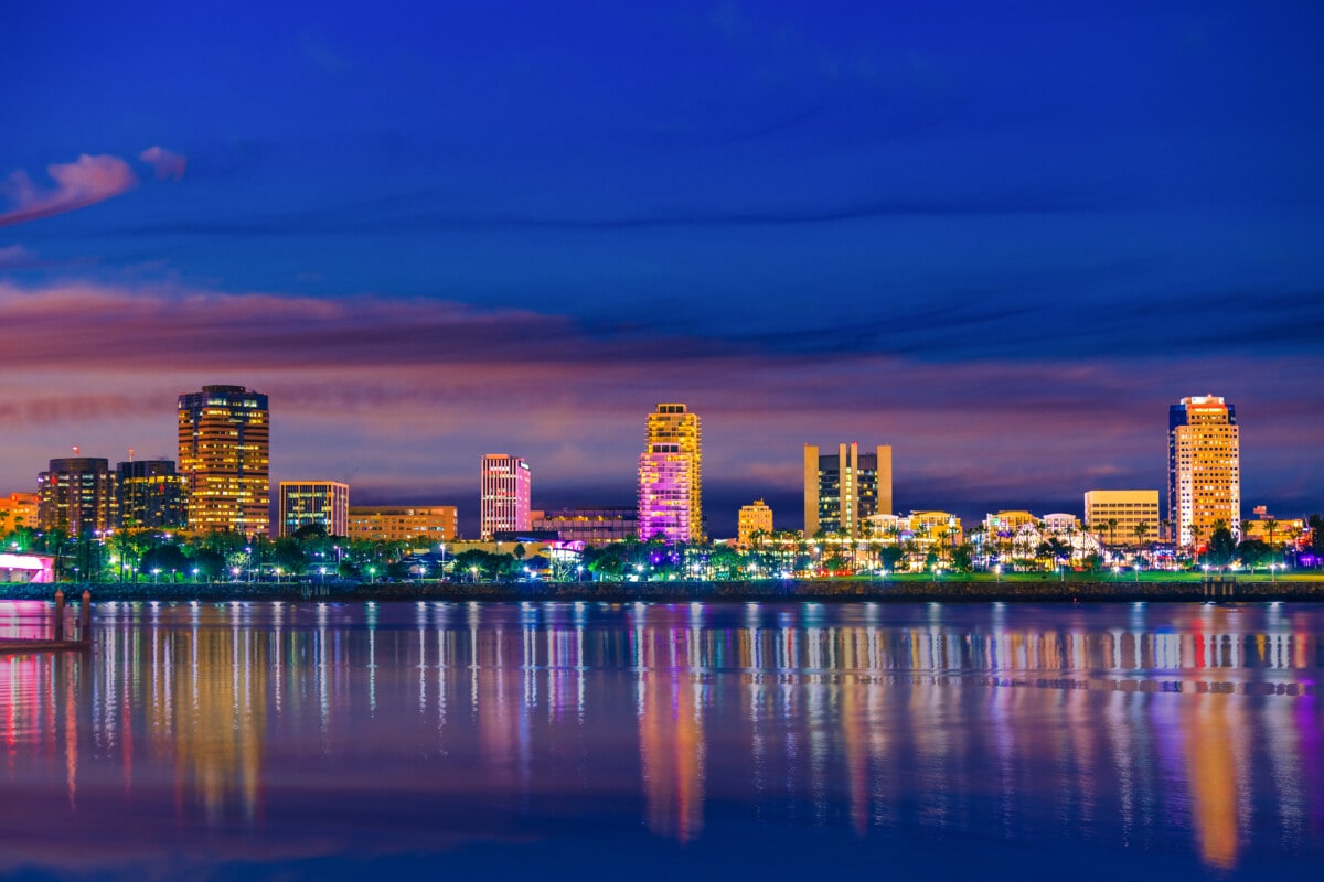 Long Beach Harbor with skyline and waterfront at night, CA _ getty