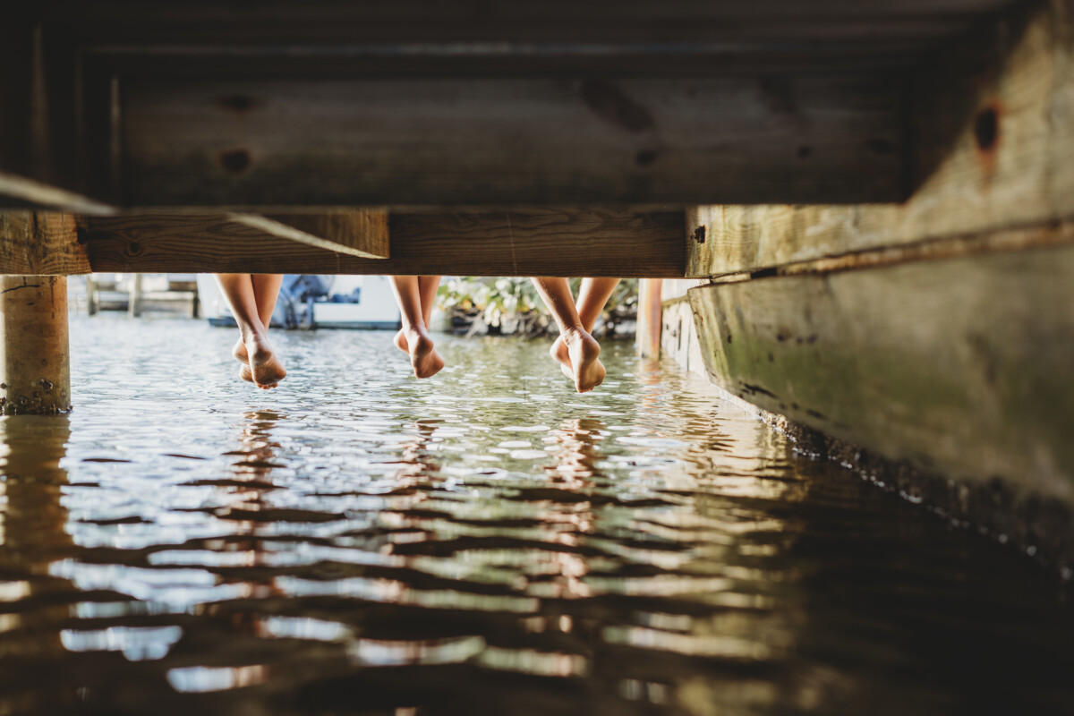 friends relaxing on a pier