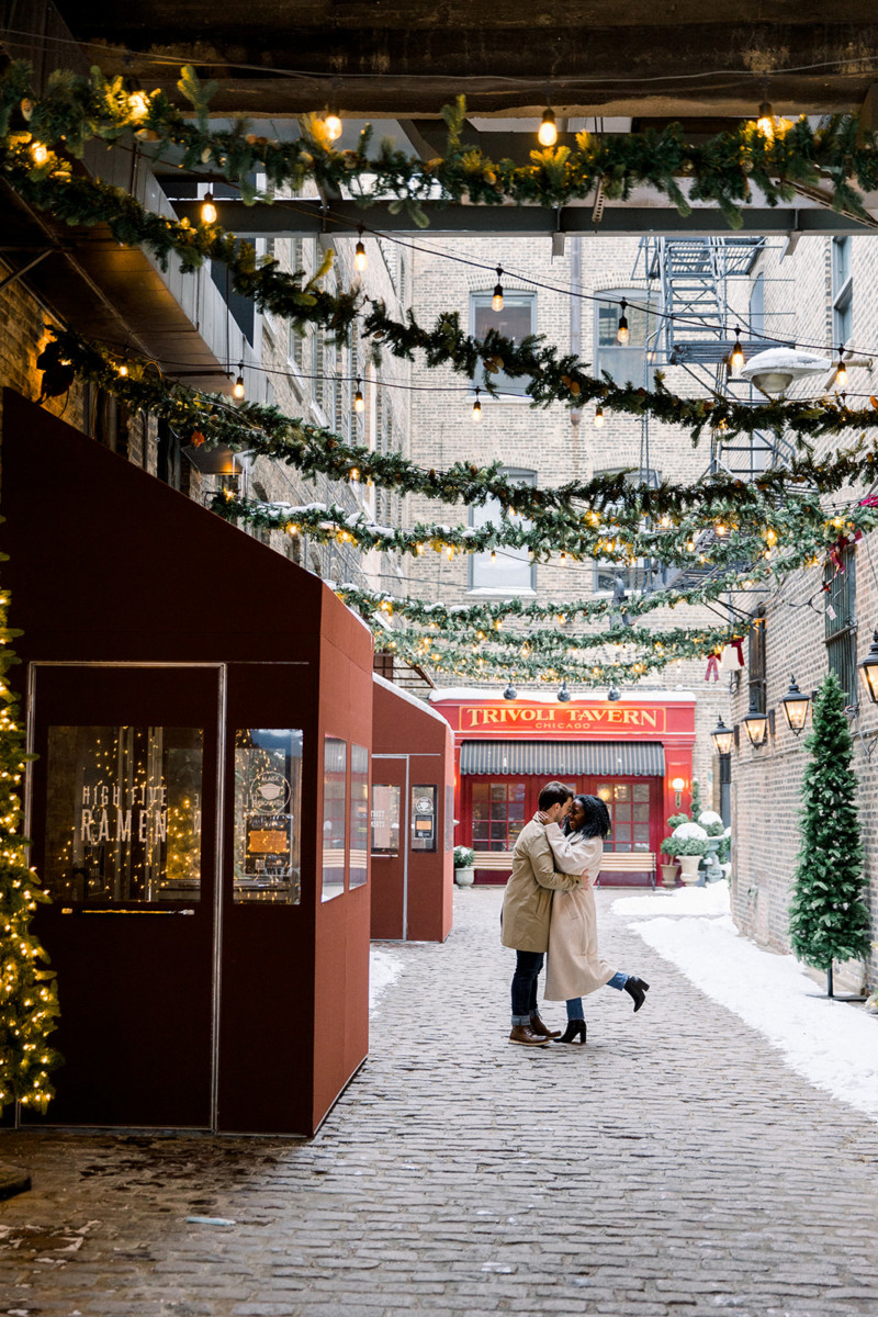 A couple embracing in an alley