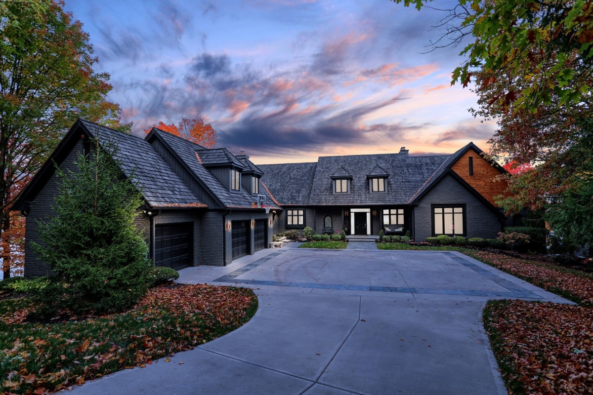 grand driveway leading to home's entryway