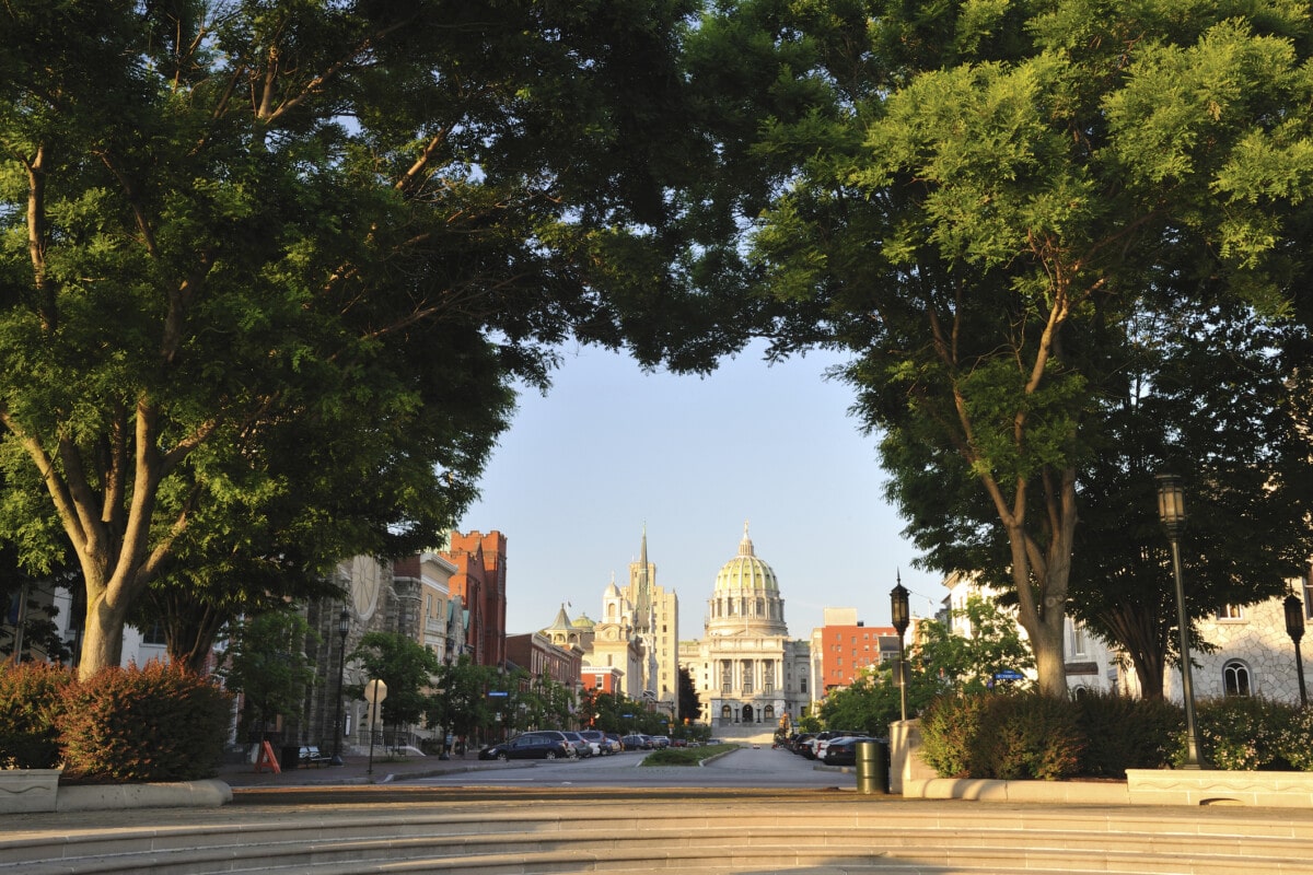 Harrisburg Pennsylvania at sunset through trees_Getty