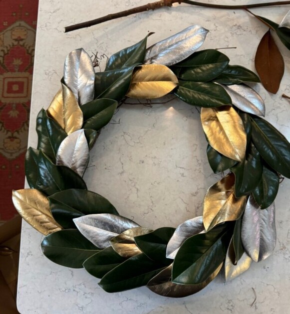 A holiday wreath with metallic spray paint