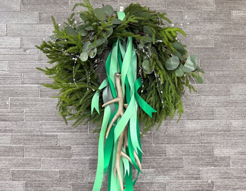 A holiday wreath with an added surprise: reindeer antlers