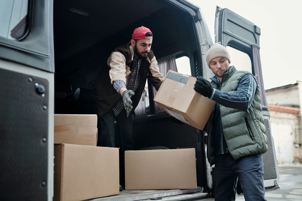 men with moving boxes in a truck