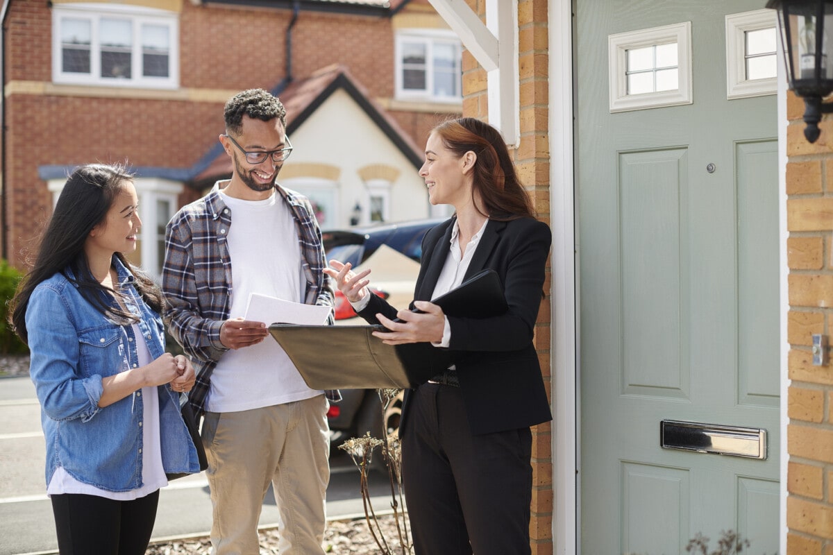 Realtor showing a couple a house in Michigan