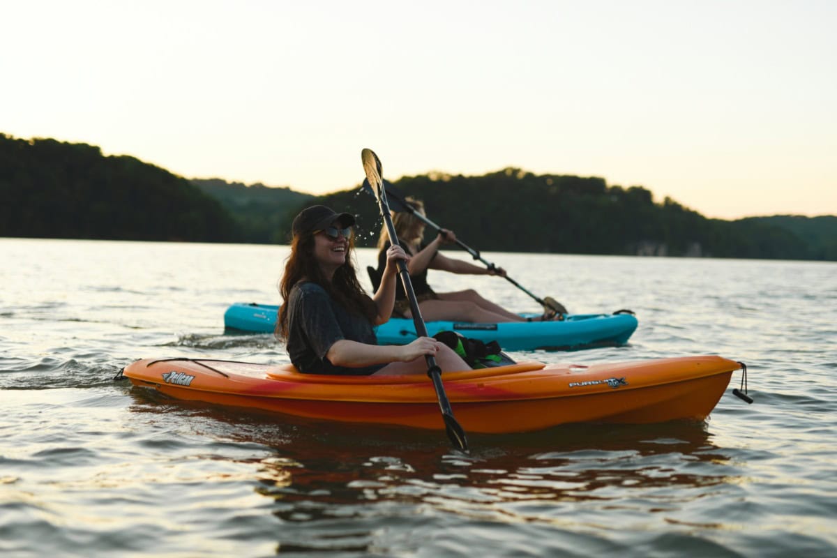 Two people kayaking on a lake