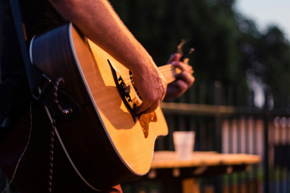 Close up shot of someone playing a guitar
