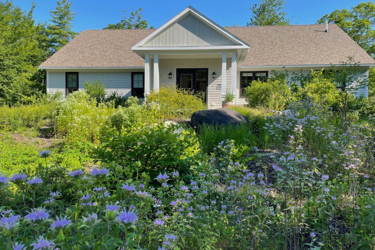 Home with diverse front yard garden