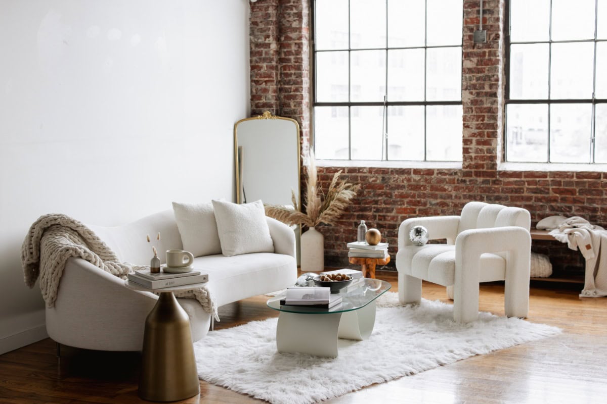 Studio view white furniture and brick wall