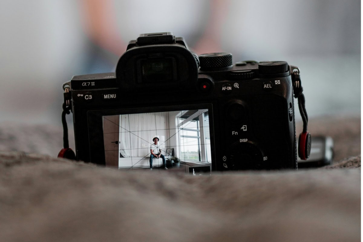 Camera Viewfinder view of man sitting