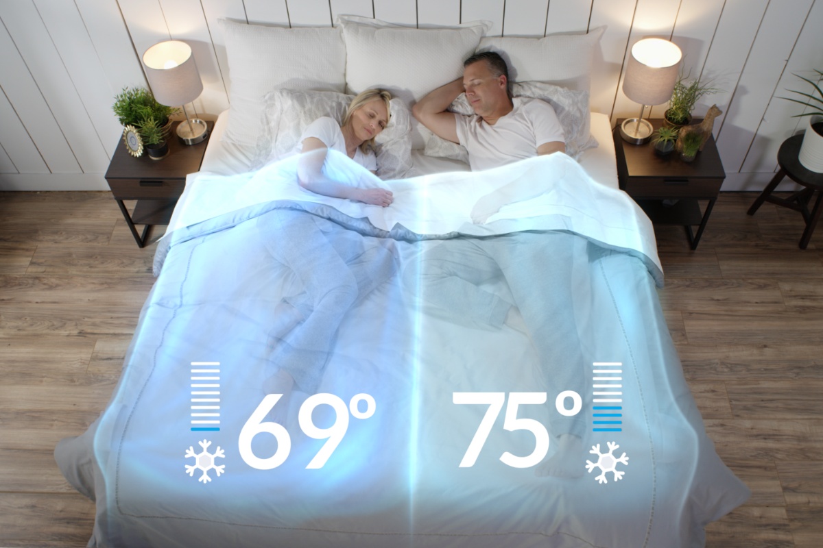 A couple sleeps peacefully on cooling sheets for hot sleepers, with one side of the bed displaying 69 degrees and the other 75 degrees, highlighting the sheets' temperature-regulating benefits