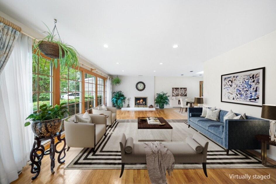 Living room with interior plants and sofa and fireplace