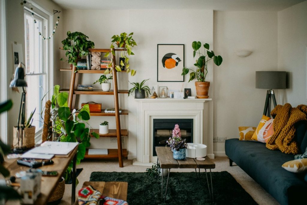Strategically placed lamps and a wall sconce illuminate this living room