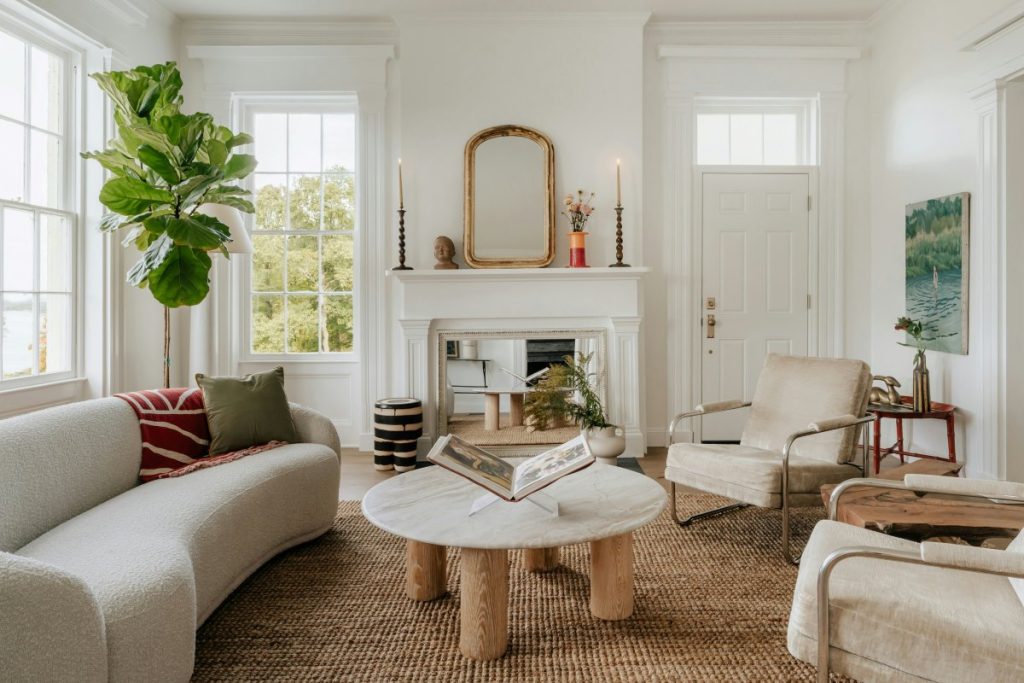 Light-colored walls, plenty of windows, and neutral furniture make this entry/living room feel extra bright