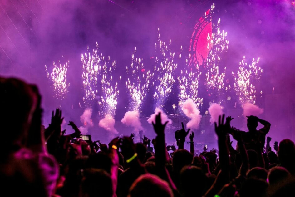 Inside a club with people hands in the air