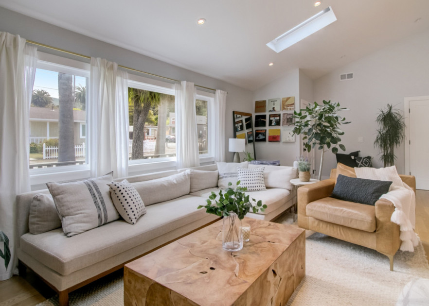 A living room with a couch, chair, and coffee table