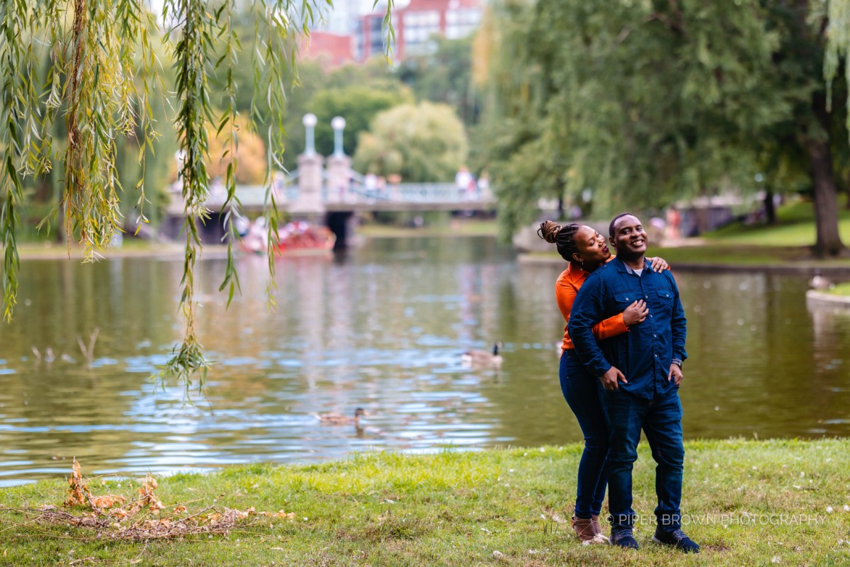 Couple embracing under a tree