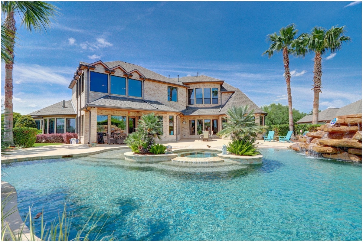 A large pool and palm trees