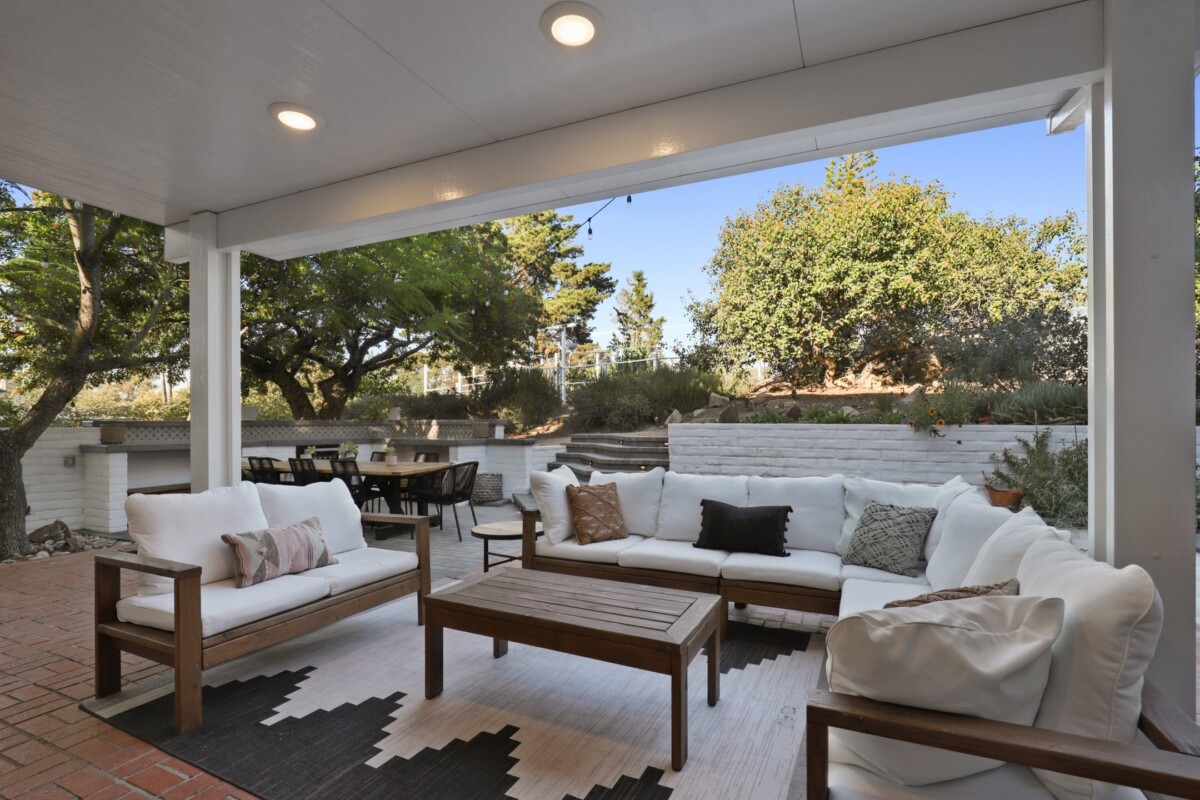 An enclosed patio with furniture