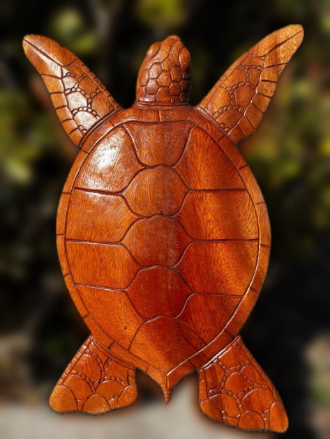 A hand-carved wooden turtle statuette made by Burst Living.