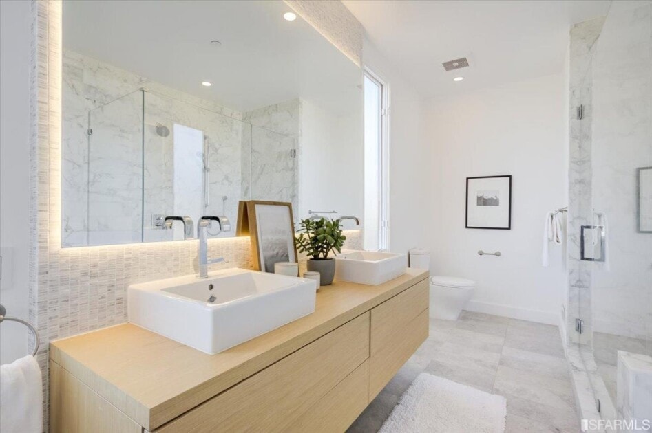 Luxurious bathroom with wood accents and marble