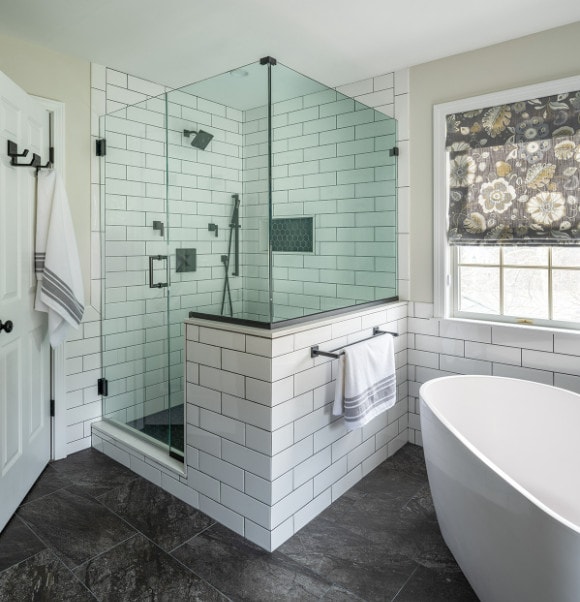 Bathroom with black floors and walk-in shower