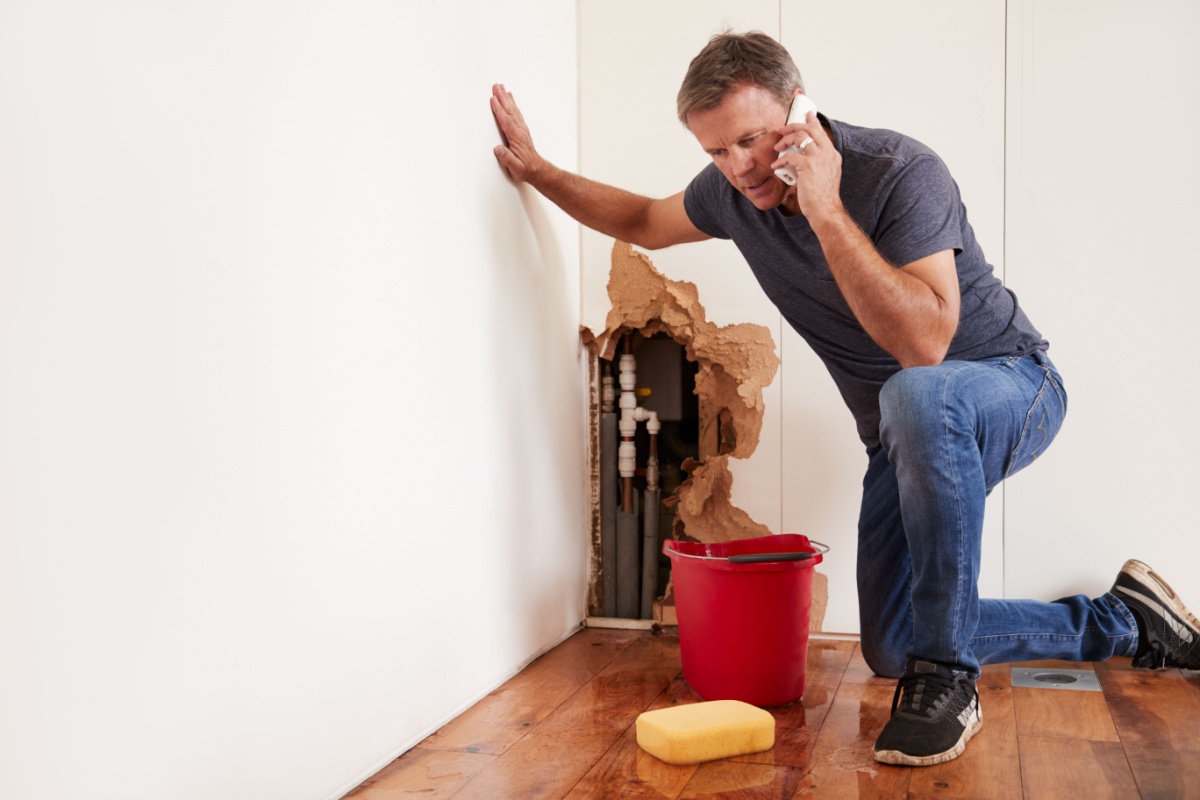 Man stressing out over extensive water damage in his home