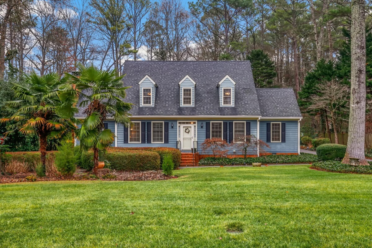 blue and gray home with trees in Snellville Georgia