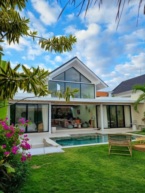 View of the back yard of a modern home with pool