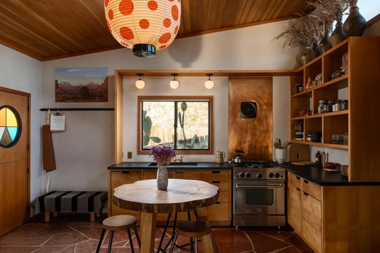 Materials include vertical-grain Douglas fir wood, warm white plastered oversized steel-framed windows. 