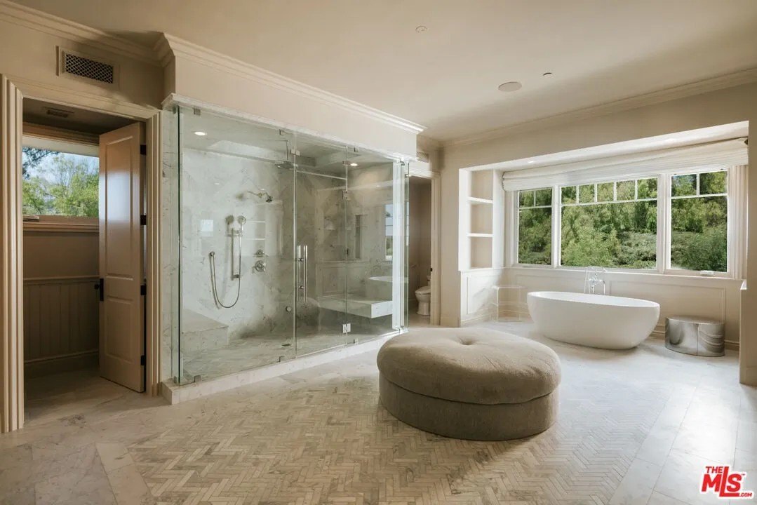 A bathroom with a tub and large shower in a home in Hidden Hills California belonging to Kylie Jenner