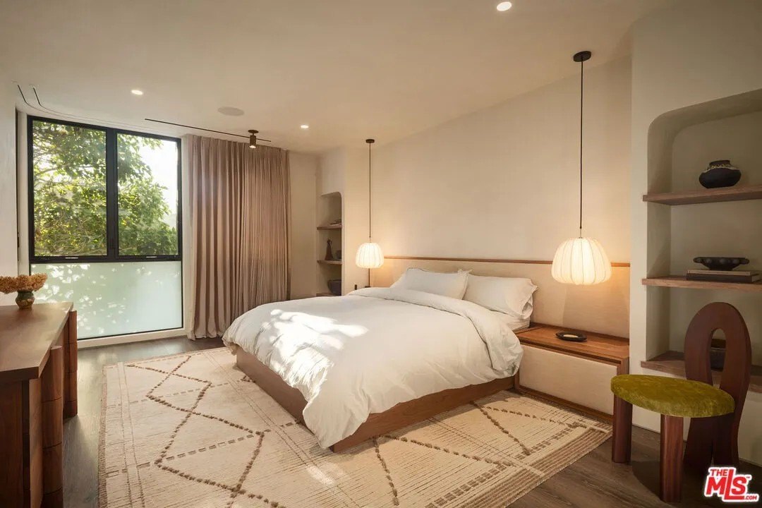 Bedroom with low hanging pendants in a luxury home in Malibu owned by Gal Gadot