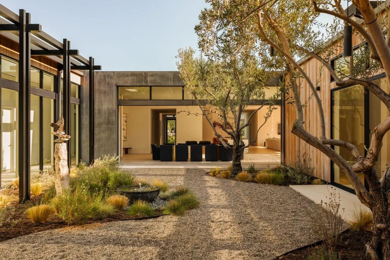 From the outside, the expanses of wood and glass help the structures to better blend with their scenic, natural surroundings.