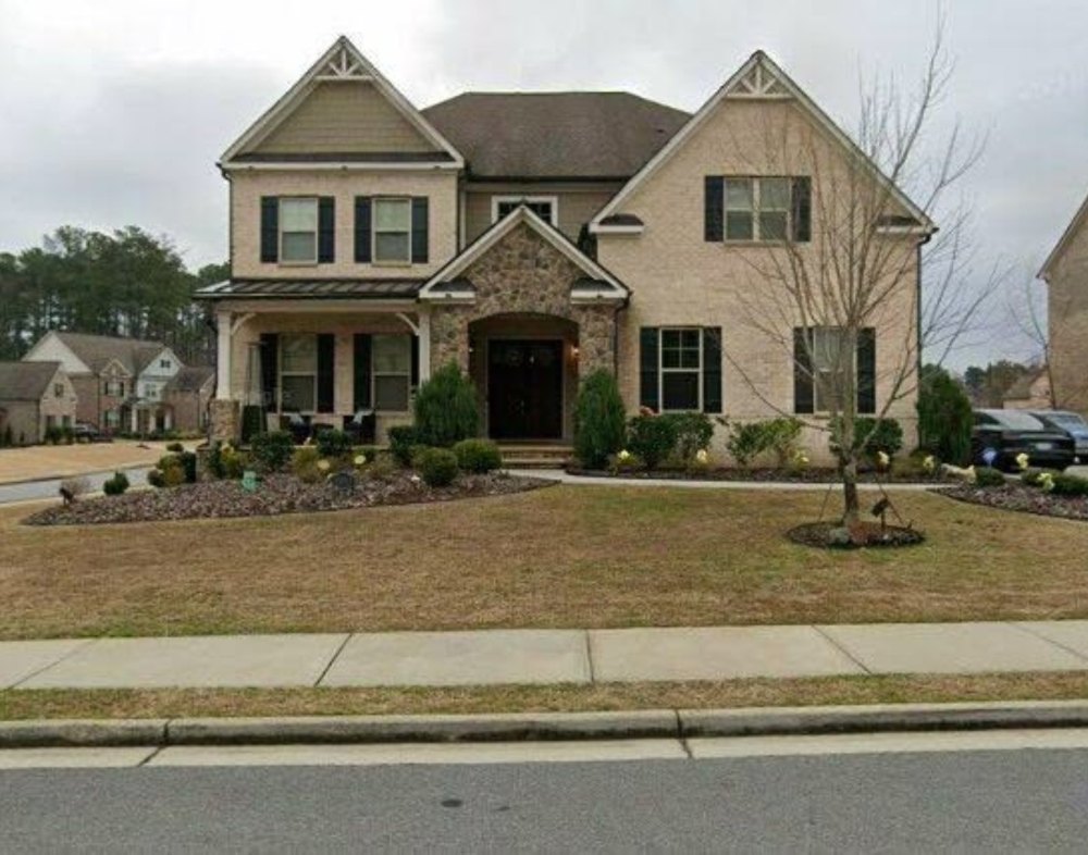 Eva Marcille Sued by Homeowners Association Over $22k in Fines Street view of a home in Alpharetta, GA.