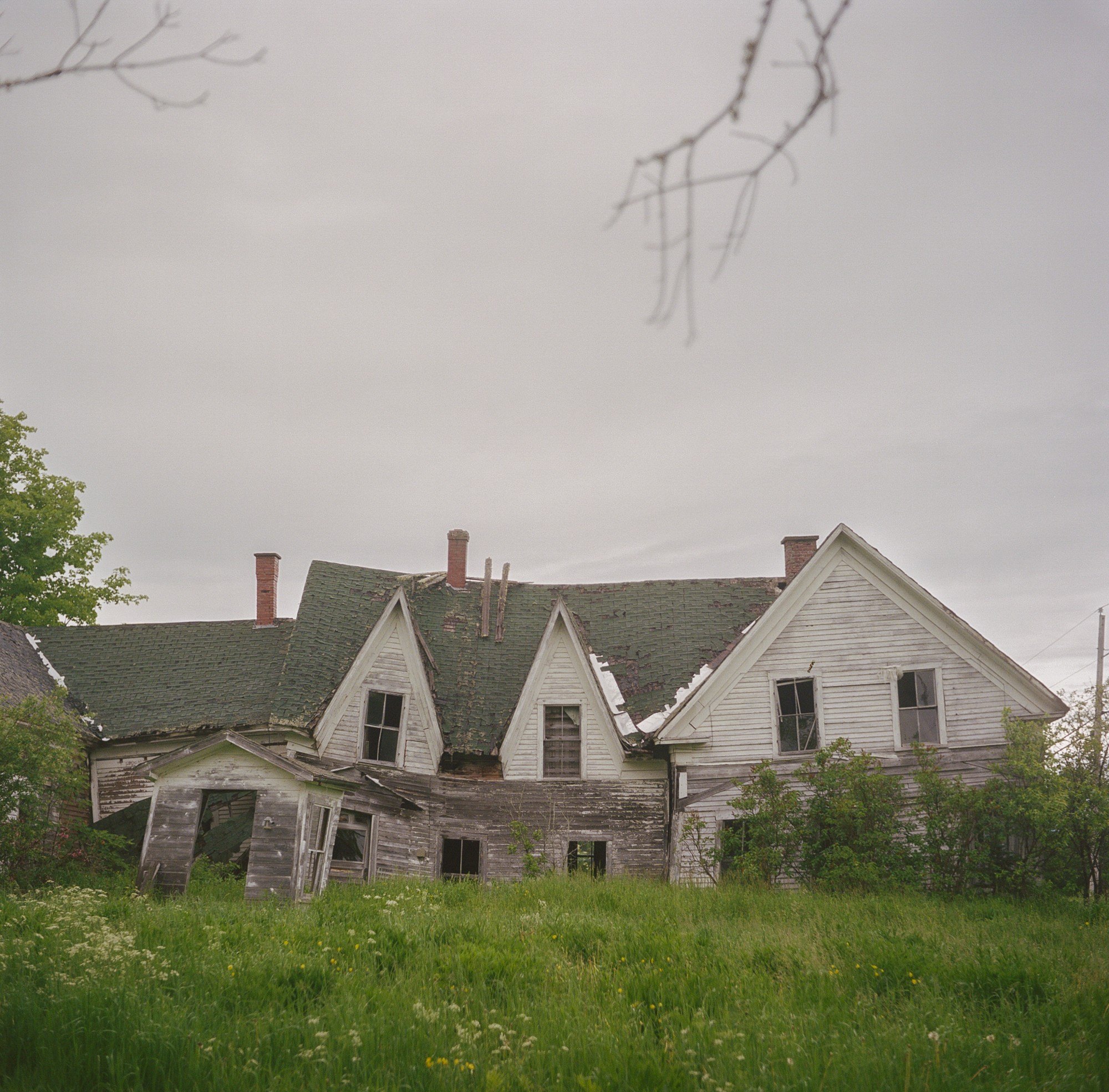 An abandoned house where the land has become unstable and caused buckling in Houlton Maine