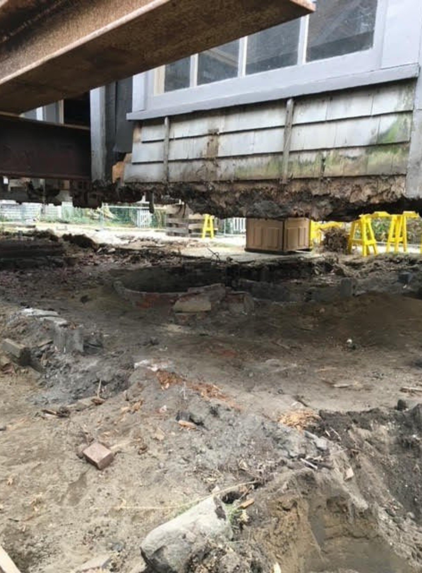 The entire structure had to be lifted up on temporary platforms, and a new foundation needed to be excavated and poured below it.