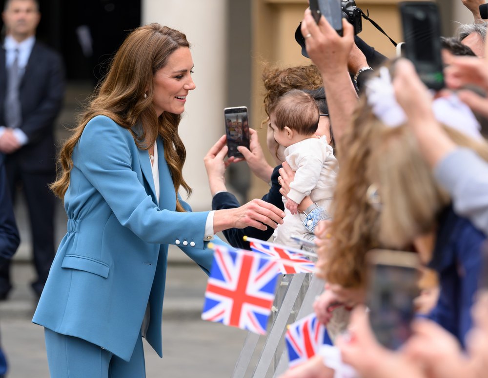 Catherine, Princess of Wales greets the crowd as she visits the Piazza Camillo Prampolini where she is welcomed to the city at Reggio Emilia’s Town Hall during the first day of her visit to Reggio Emilia on May 13, 2026 in Reggio Emilia, Italy. The Princess of Wales is visiting the city in Northern Italy as The Royal Foundation Centre for Early Childhood expands internationally.