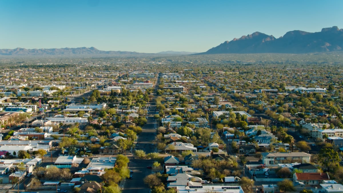 Residential and commercial properties stretch to the mountains beyond Tucson, Arizona.