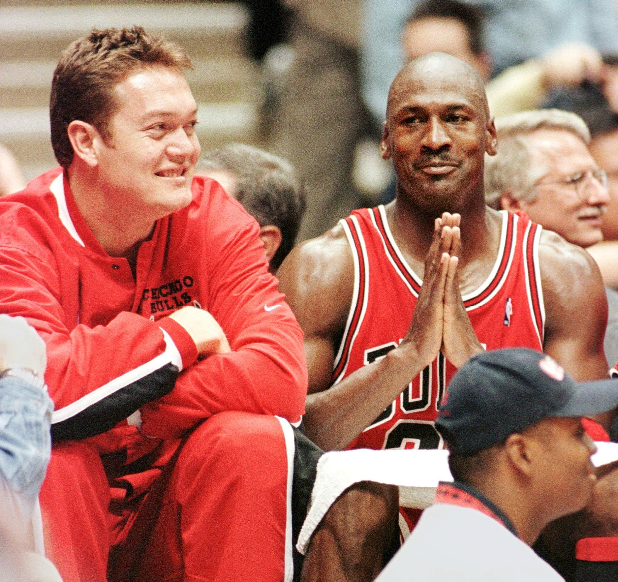 Luc Longley (L) and Michael Jordan (R) of the Chicago Bulls celebrate their win over the New Jersey Nets, 116-101, in the first round of playoffs 29 April at Continental Arena in East Rutherford, New Jersey. The Bulls won the series, 3 games to none. Jordan had 38 points in the game. AFP PHOTO Stan HONDA (Photo by STAN HONDA / AFP) (Photo credit should read STAN HONDA/AFP via Getty Images)